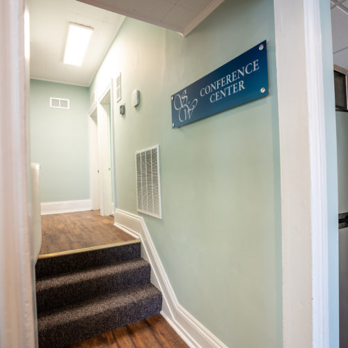 Hallway-with-Sign-1-min Hallway-with-Sign-1-min